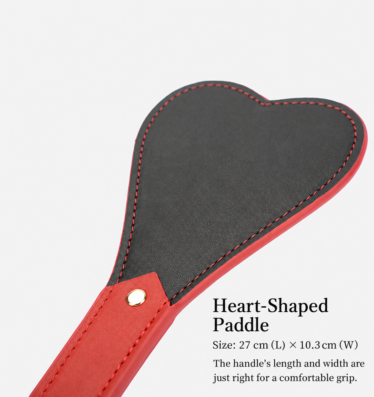 Black and red heart-shaped PU leather paddle with reinforced stitching