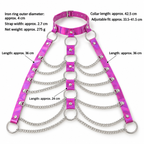 Close-up of iridescent pink straps, metal rings and layered silver-tone chains