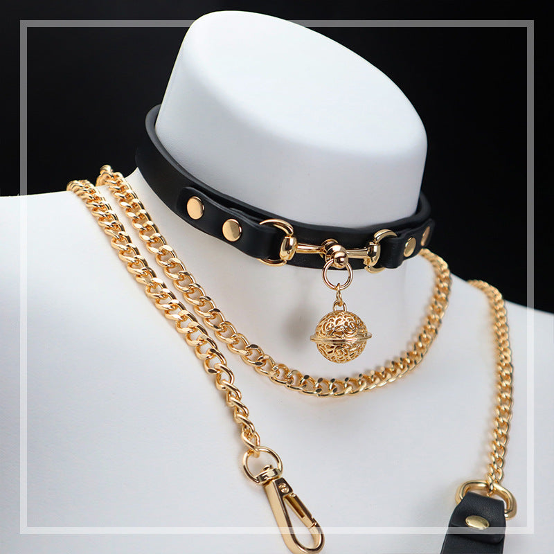 White bell collar with decorative gold-tone bell and matching chain leash