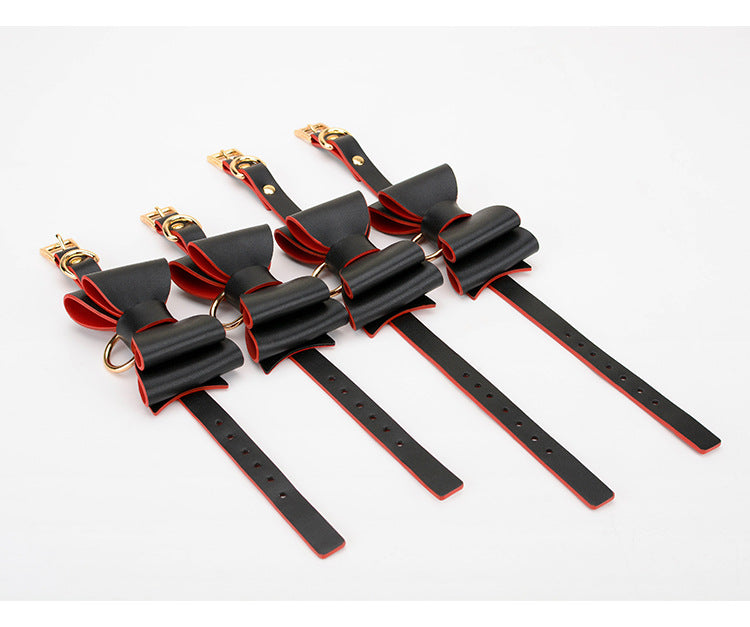 Four adjustable black and red PU leather bow cuffs