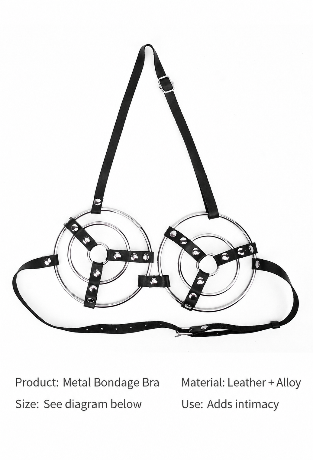 Close-up of silver-tone concentric rings and studded black straps on harness bra