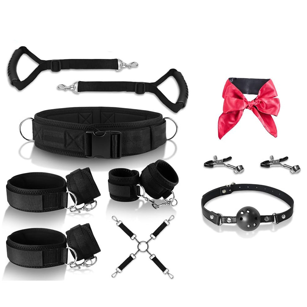 Complete black padded restraint kit with belt, handles, cuffs, blindfold, gag, clamps, and cross connector