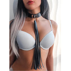 Black collar with long tassel worn around the neck
