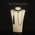 Five-bell black collar and chain leash displayed on mannequin