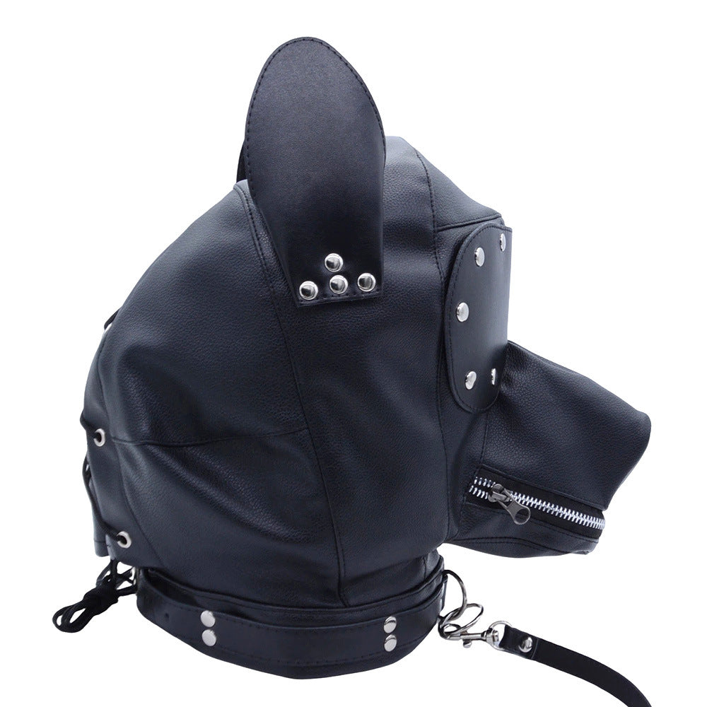 Black puppy play hood with removable eye cover and matching leash laid out
