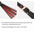 Black and red PU leather tassel flogger with gold-tone ring and rivets