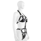 Close-up of black cutout harness top with silver-tone rings and rivets
