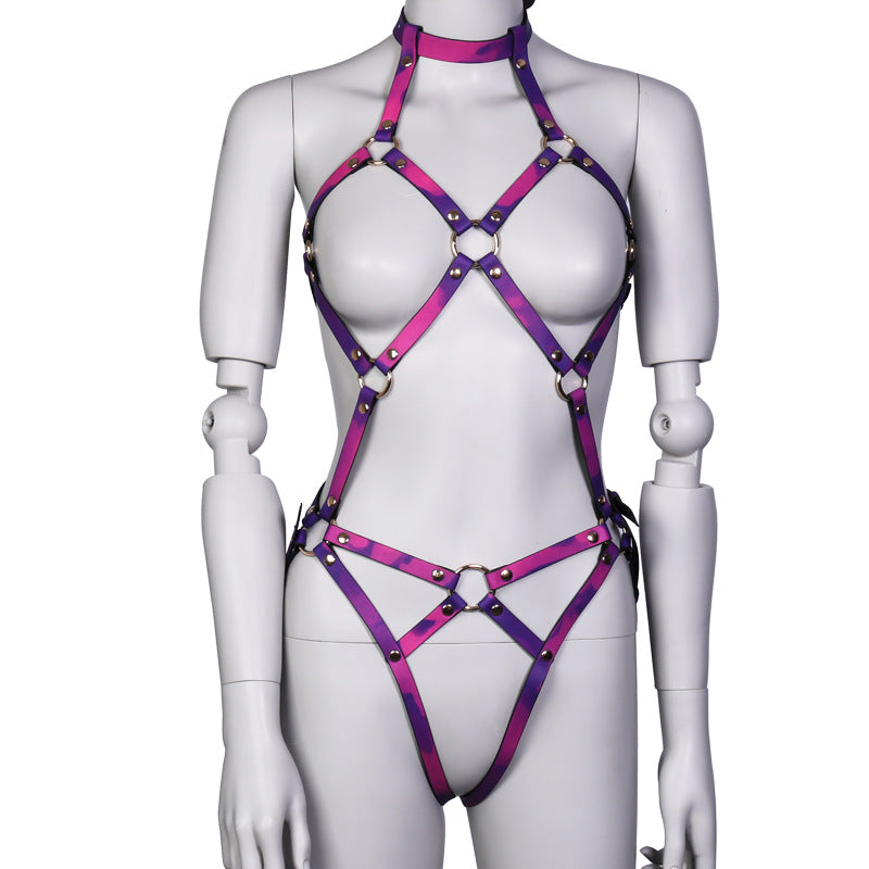 Purple ring-detail body harness with geometric hip straps on mannequin