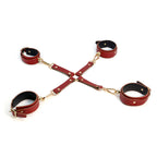 Burgundy red four-cuff leather restraint connector with gold-tone clips